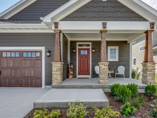 Professional Garage Door Repair Team in Taylorsville Front porch of a modern Taylorsville home with a new garage door and welcoming entryway