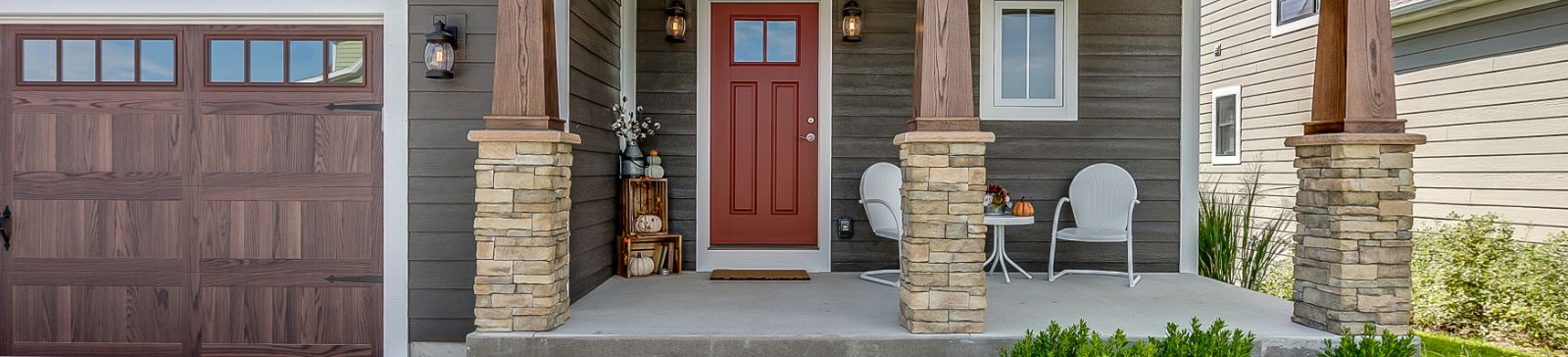 Front porch of a modern Taylorsville home with a new garage door and welcoming entryway